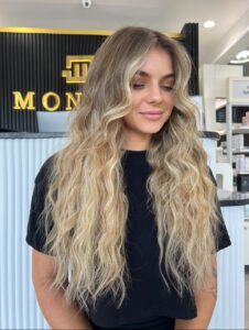 Y2K Hair is Back: What Millennials Want at Monaco Salon Y2K Style: lots of hair, chunky highlights around face